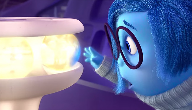 A screen shot the movie "Inside Out" depicts Sadness' effect on memories. ©Disney Pixar, 2015.
