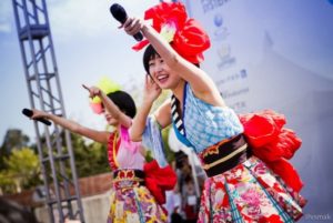 Women sing during "J-Pop Summit 2014" in San Francisco, CA. Image by Vincent Samaco, July 19, 2014. Available via Flickr.